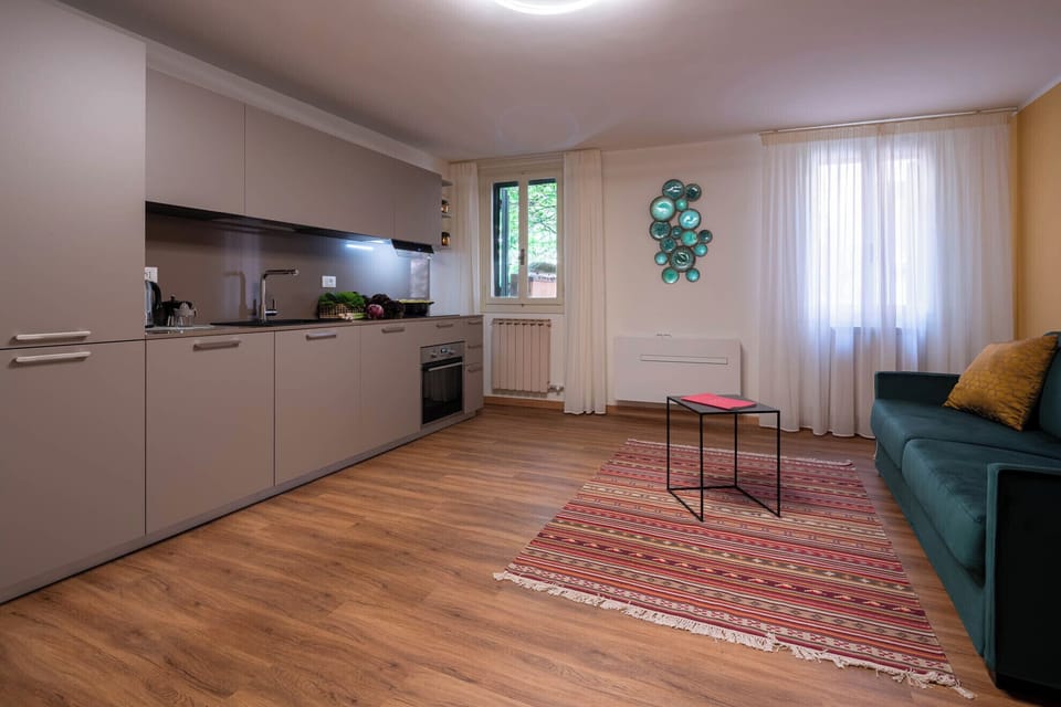 Condo, Garden View | Living area | Flat-screen TV