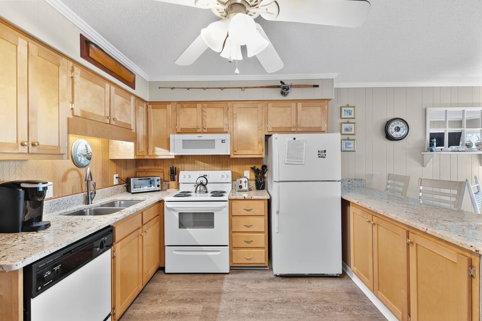 Kitchen - Well-appointed kitchen with modern appliances, ample counter space, and everything needed to prepare meals and snacks during your stay.