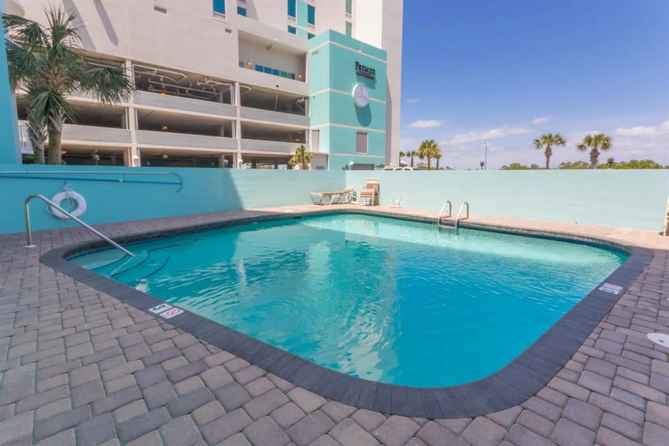 A sparkling private pool, exclusive to the complex, offering a serene and refreshing retreat just steps from the beach.