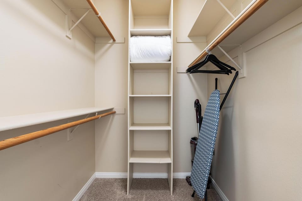Spacious walk-in closet with ample storage for a clutter-free stay 👗🧥