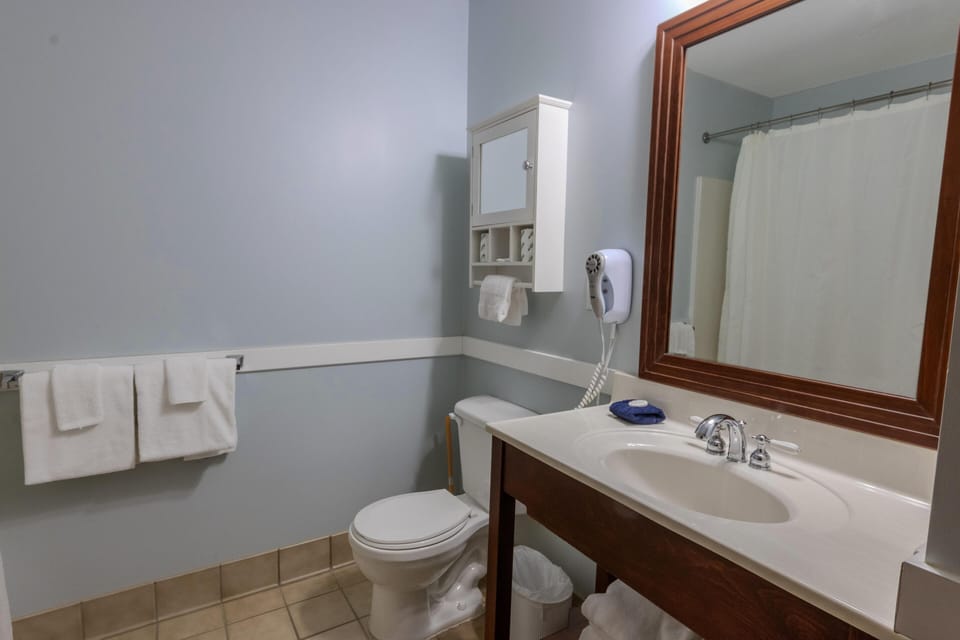 The updated bathroom with a modern vanity.