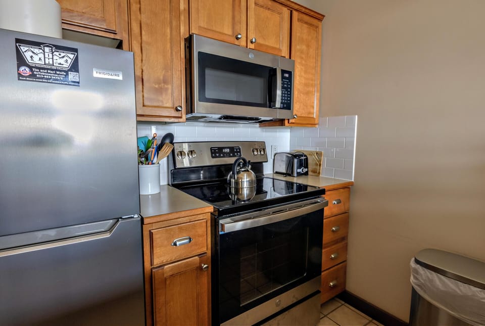 The full kitchen is equipped with all the essentials you need to whip up delicious homemade meals.