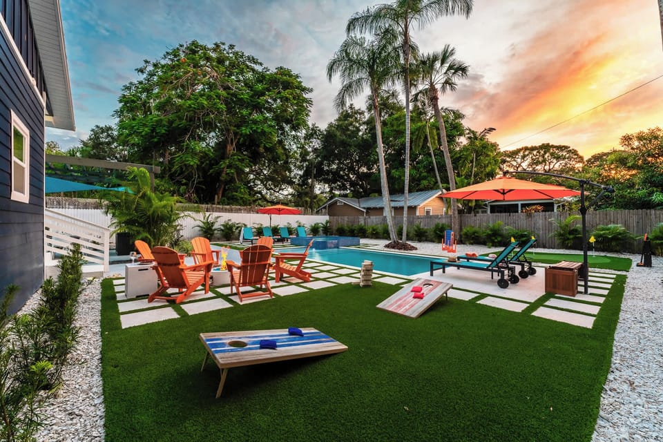 Enjoy cornhole fun, the sparkling pool, the putting green, and the cozy fire pit during each sunset!