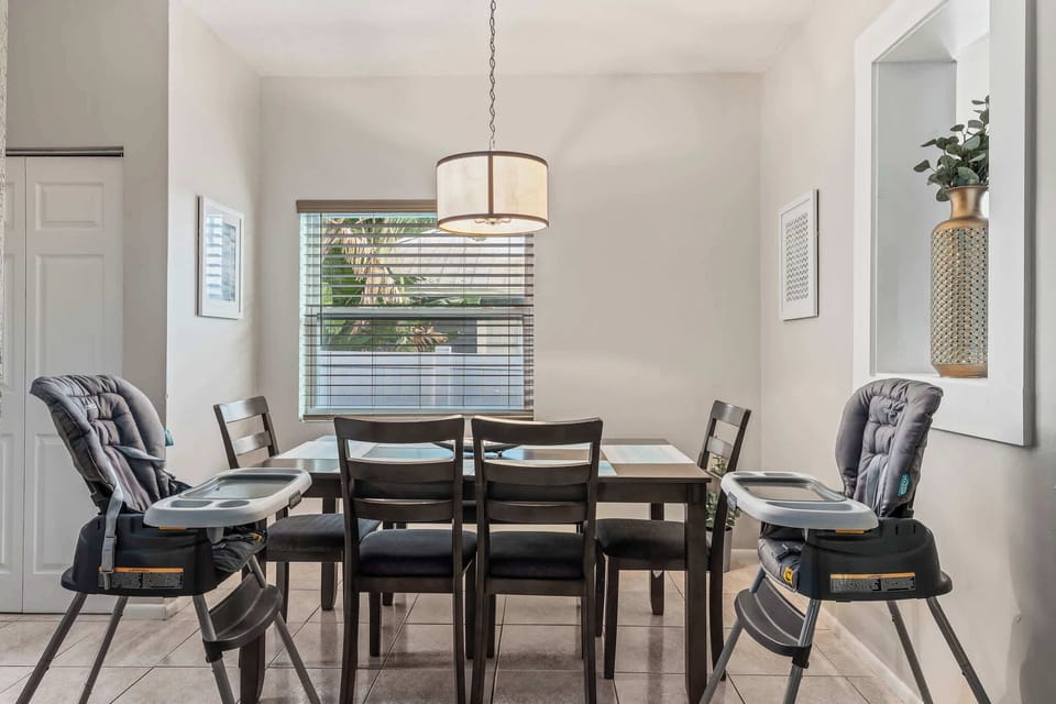 Gather around our spacious dining table, perfect for family meals and memories! With two high chairs, everyone is welcome at the table. 