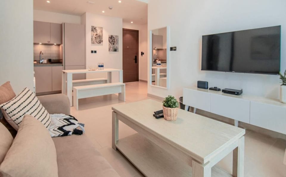 Prepare meals in this fully equipped kitchen, complete with modern appliances, and enjoy them in the cozy dining area perfect for gatherings.
