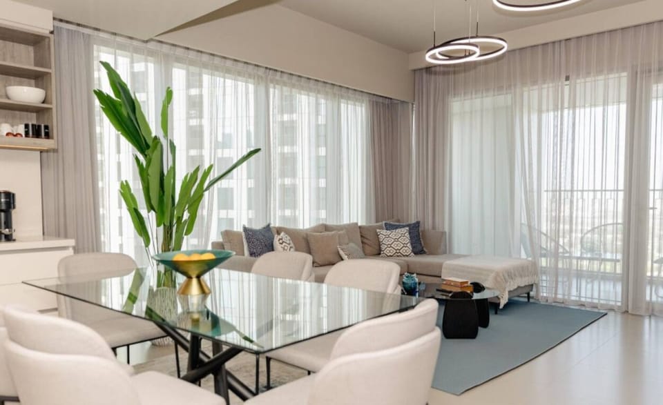 Chic dining space overlooking a bright and spacious living area, ideal for gathering with family and friends.