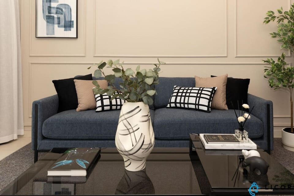Relax in the chic and cozy living room, featuring modern decor, plush seating, and beautiful accents that create a welcoming atmosphere.