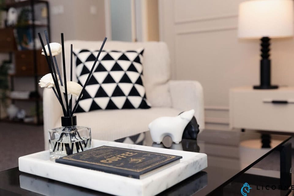 The living room is beautifully accented with modern decor, creating a sophisticated yet comfortable environment to unwind after a long day.