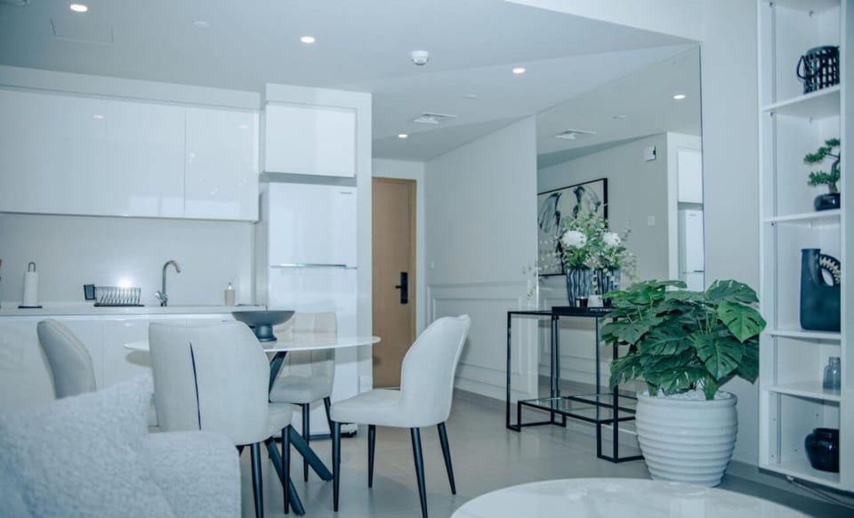 Bright and functional kitchen with modern appliances and stylish dining area for a quick bite or a home-cooked meal.