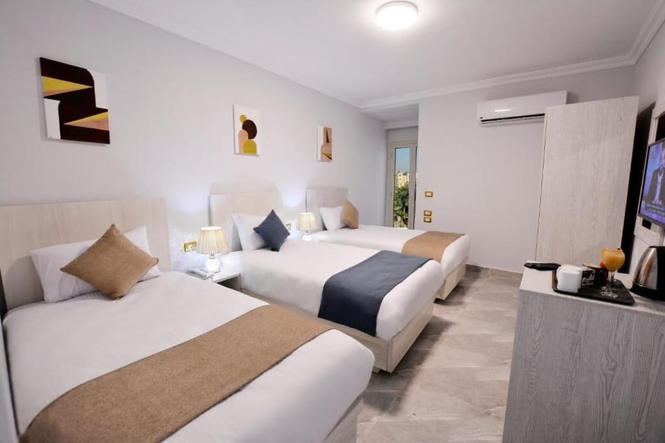 Superior Triple Room - Pyramids and museum view | Premium bedding, Select Comfort beds, in-room safe, free WiFi