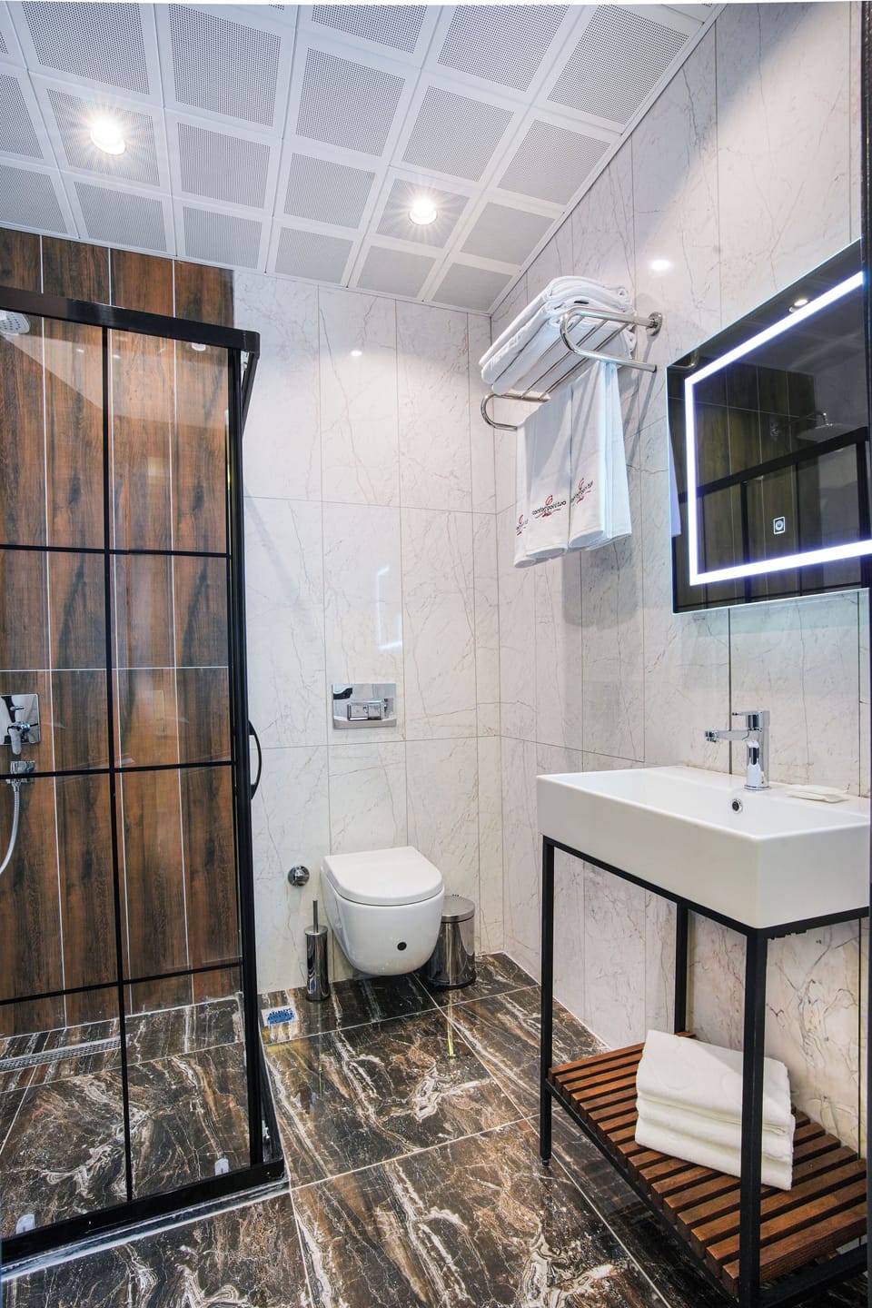 Shower, hair dryer, slippers, towels