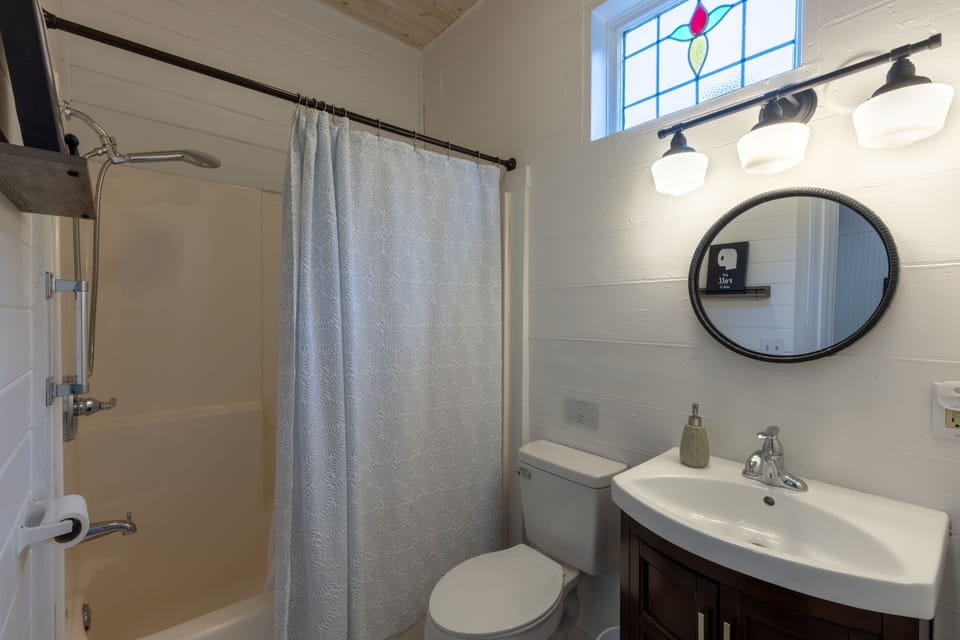 Full bathroom located off the living room.