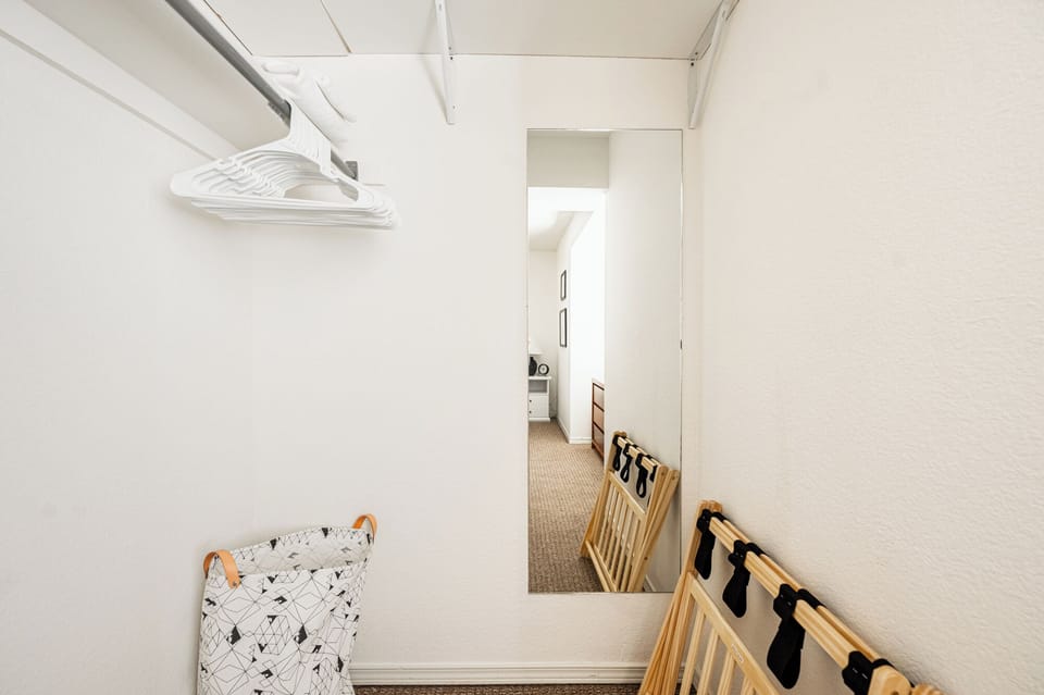 Large closet area, plenty of hangers, luggage rack, and an iron.