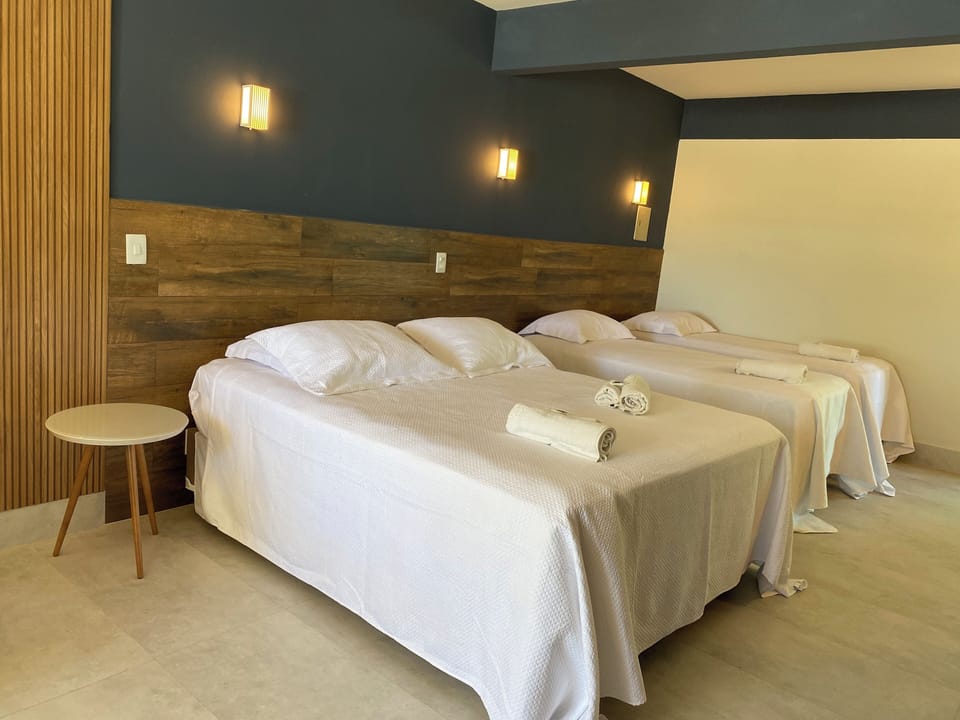 Deluxe Quadruple Room, Sea View (Com Varanda) | Minibar, bed sheets
