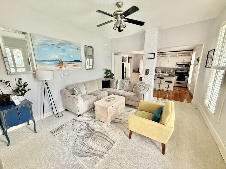Living Room - The coffee table and chair can be moved in order to fit the queen air mattress that we provide.
