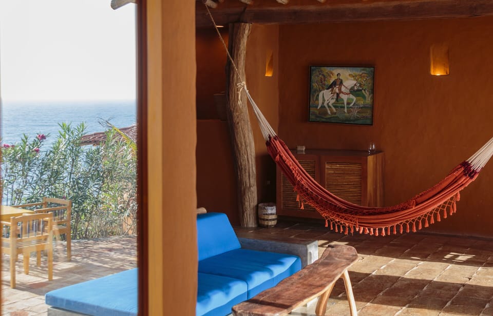 Luxury Suite, Private Pool, Sea View | Living area | Books