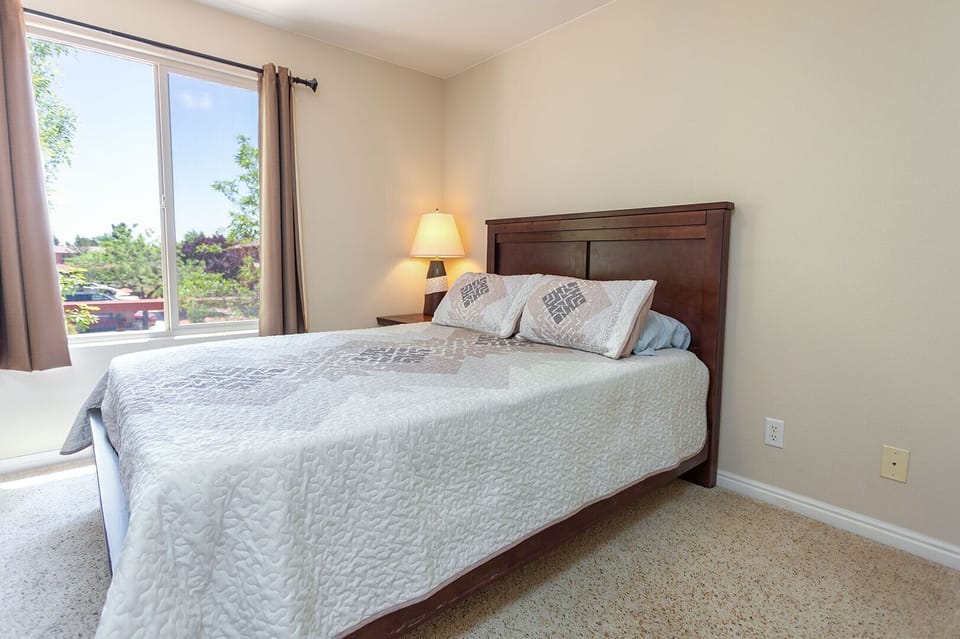 Drift off to dreamland in the third bedroom, with another cozy queen bed.