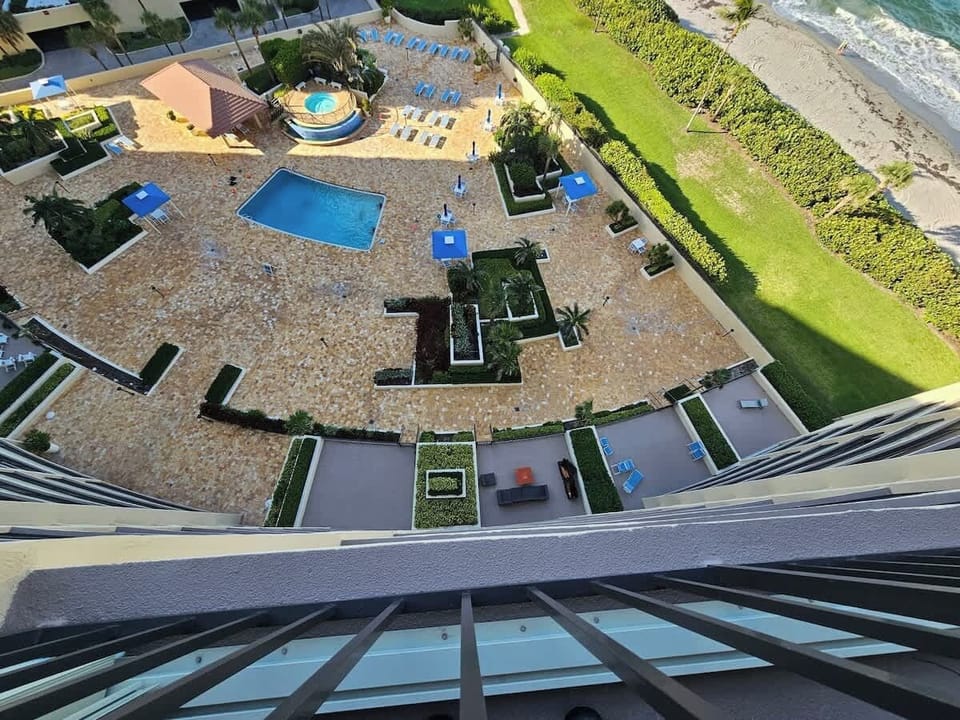 Balcony view of Pool, Hot Tub, and Beach