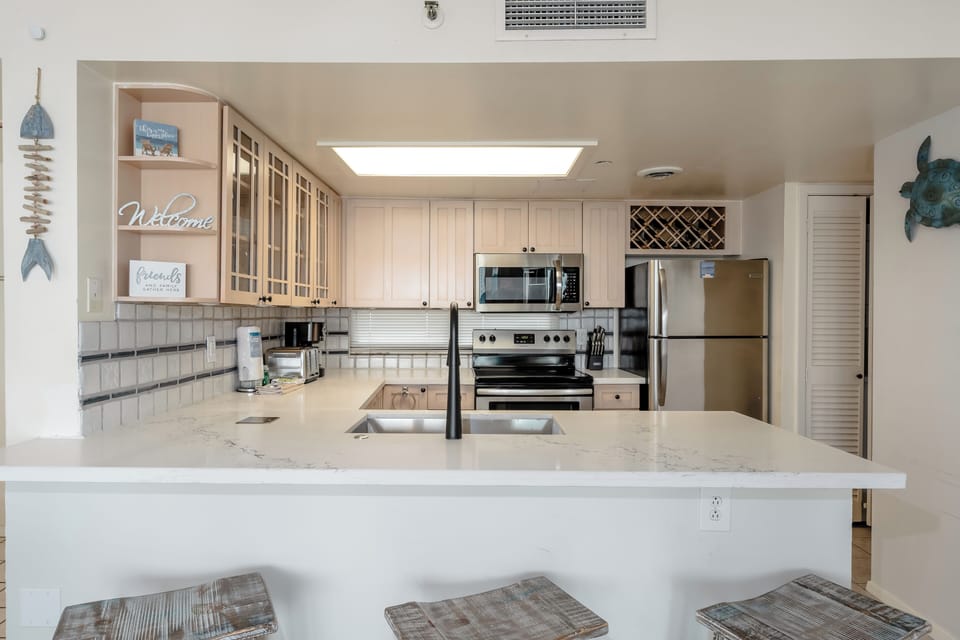 The living space opens to the breakfast bar and kitchen!
