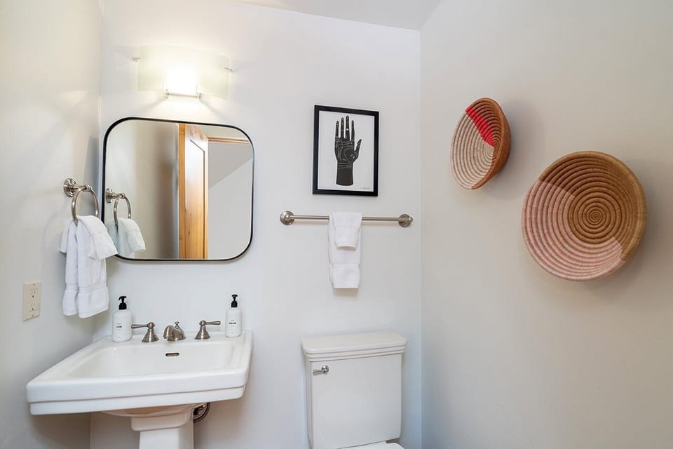 Powder Room located off the kitchen and living area.