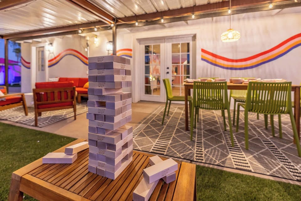 Gather for fun-filled evenings with giant Jenga and cozy outdoor dining at Rank One Stays!