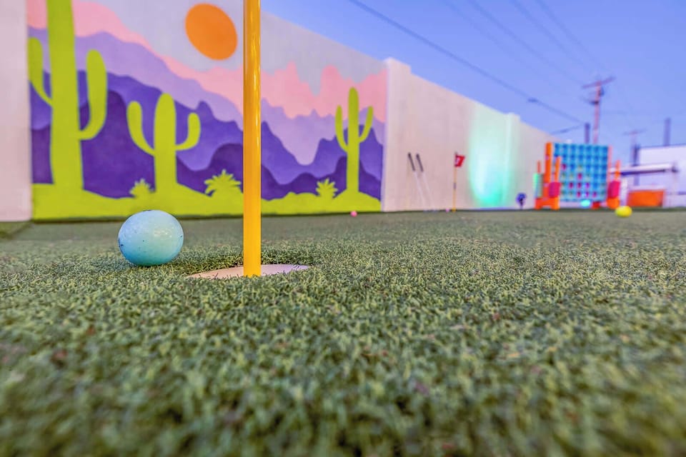 Perfect your putt with a round of mini-golf in our colorful, cactus-themed backyard!