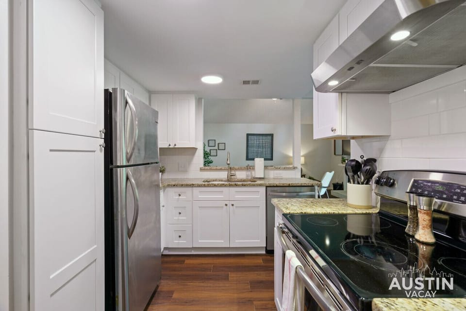 Full kitchen with all the essentials plus laundry room/ pantry