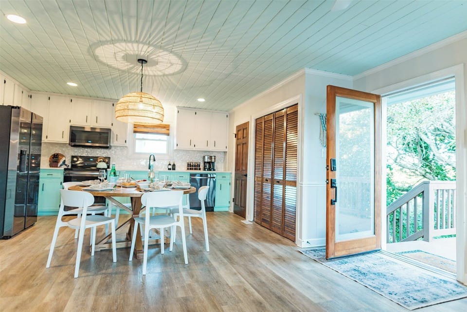 Kitchen area. Washer and dryer closet behind the bi-fold doors.