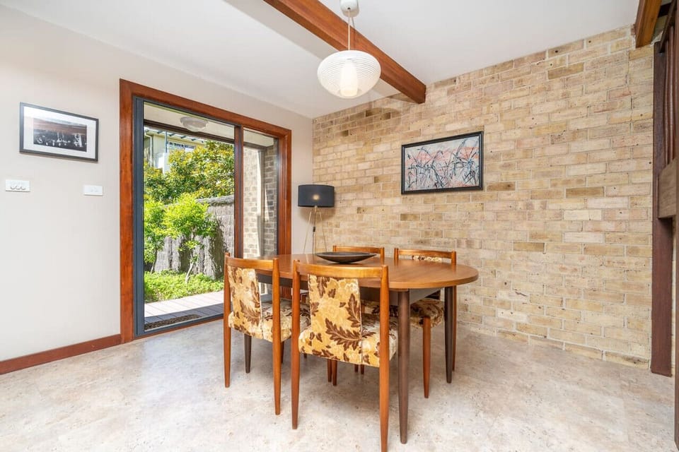 Wooden 4-seat dining table for cosy meals.