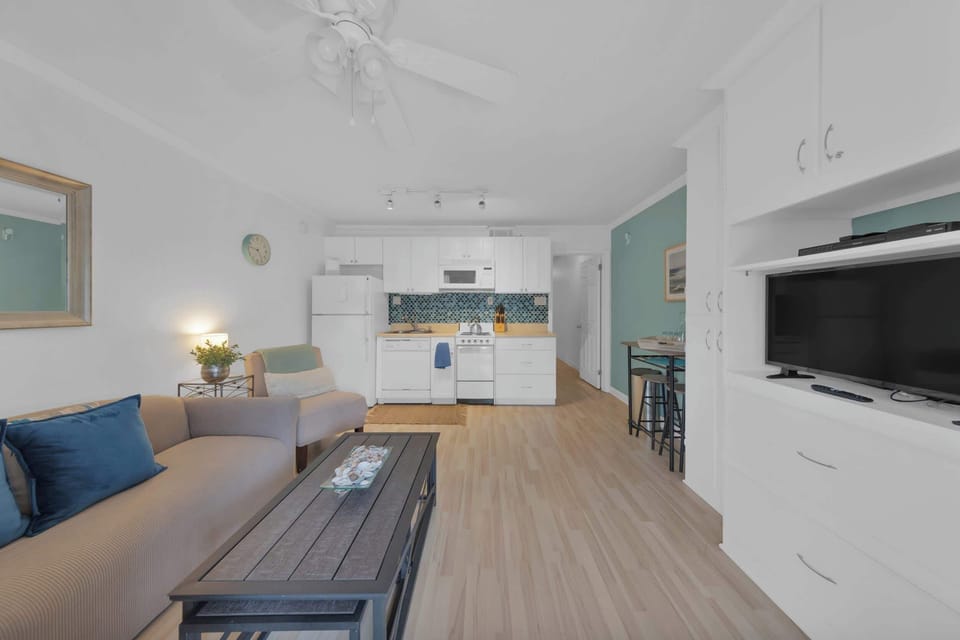 The serene kitchen area offers ample storage & all the comforts of home