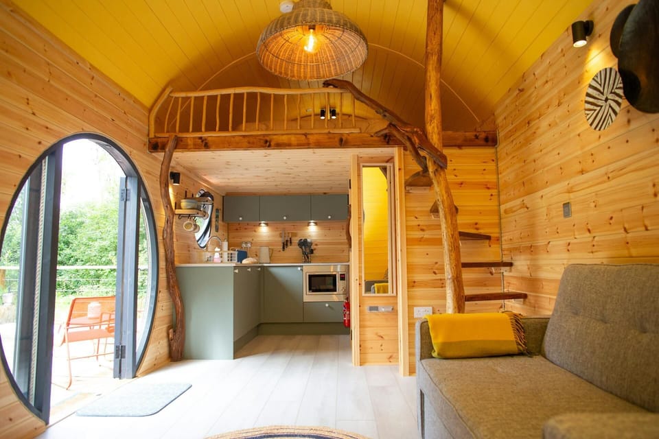 Sofa with views to the deck and woodland