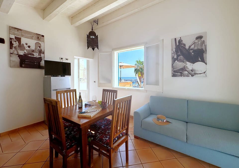 Basic Duplex, Sea View | Living area | 32-inch flat-screen TV with cable channels, TV