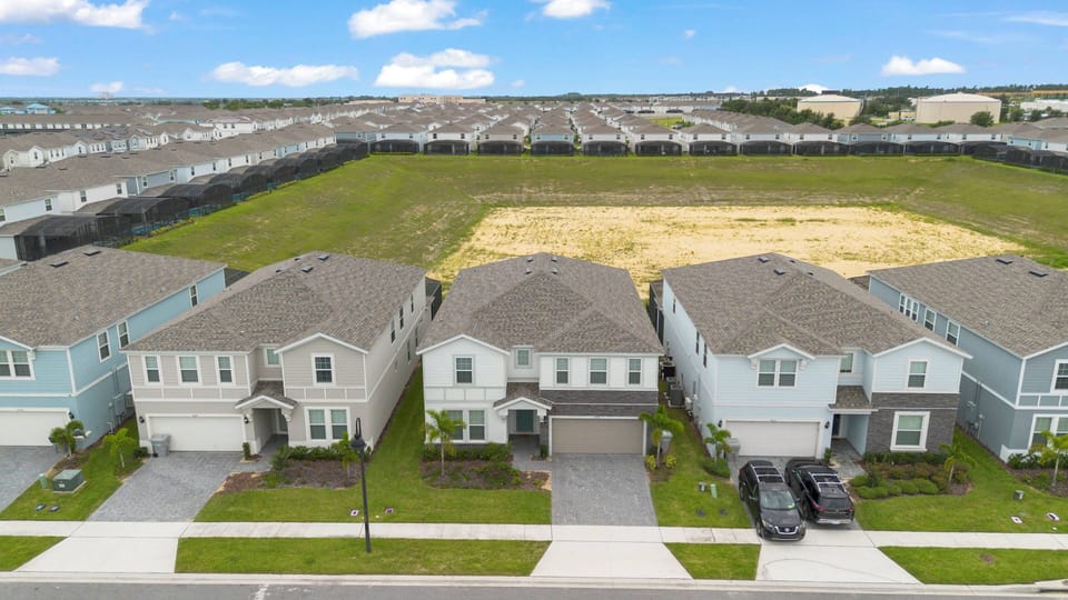 Explore a delightful neighborhood with beautifully landscaped homes in soothing blue and gray tones. Enjoy welcoming lawns that create a warm atmosphere, perfect for leisurely strolls and relaxing evenings in a friendly community.