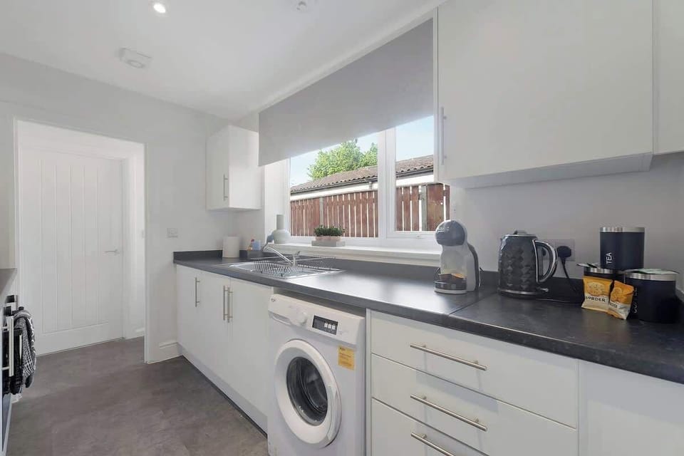 Family-friendly kitchen oasis equipped with all essentials, including a washer & dryer, oven, fridge and full cookware set. Plus, thoughtful touches like children's dinnerware ensure everyone feels right at home in this cozy culinary haven.