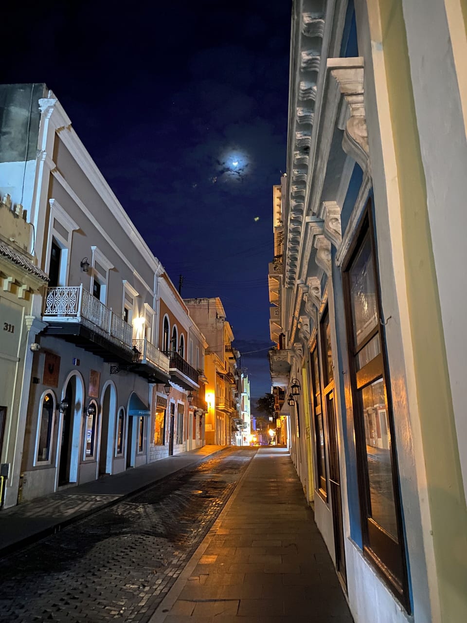 Romantic street outside the building on a magical moonlit night in Old San Juan.