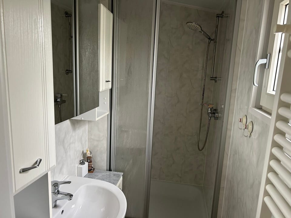 Bathroom with shower and sink