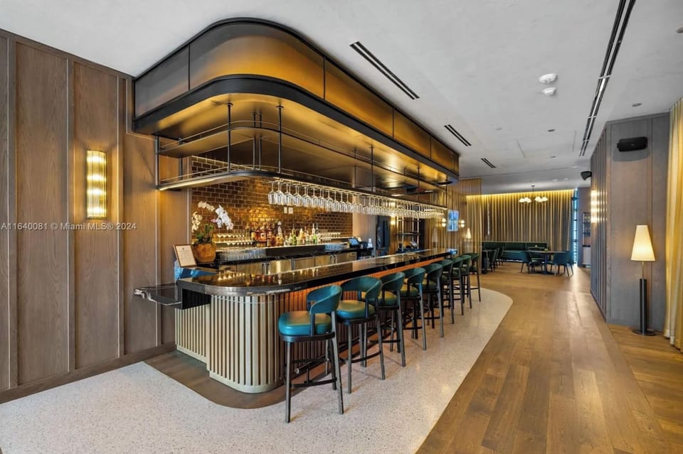 Indoor bar featuring creative cocktails, cozy seating, and a lively atmosphere!