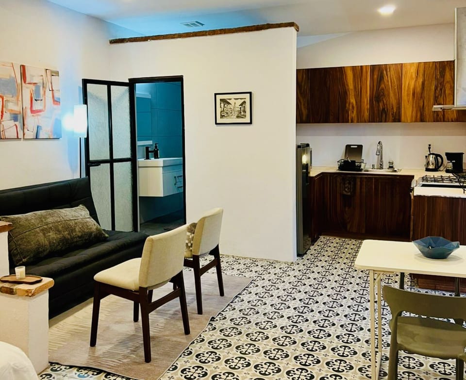 Living area converts to a second sleeping area with fold down futon