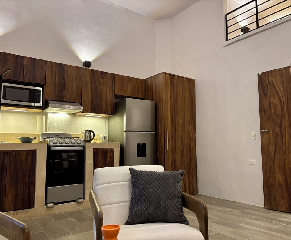 Large fridge-freezer, gas oven and stove, microwave and hidden washer-dryer