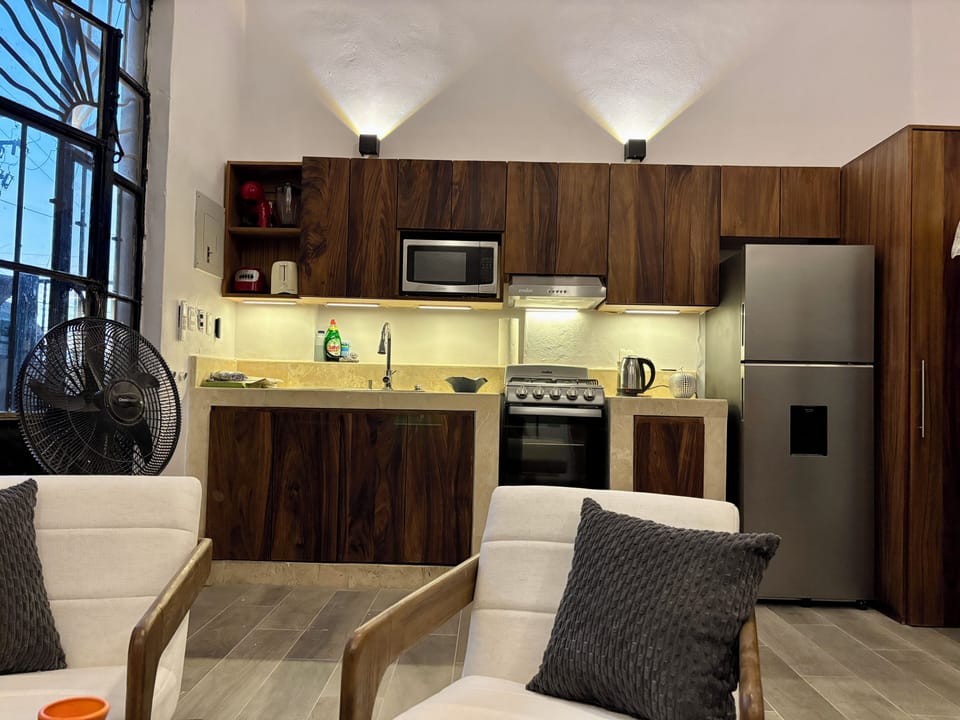 Gorgeous tropical hardwood kitchen is fully equipped