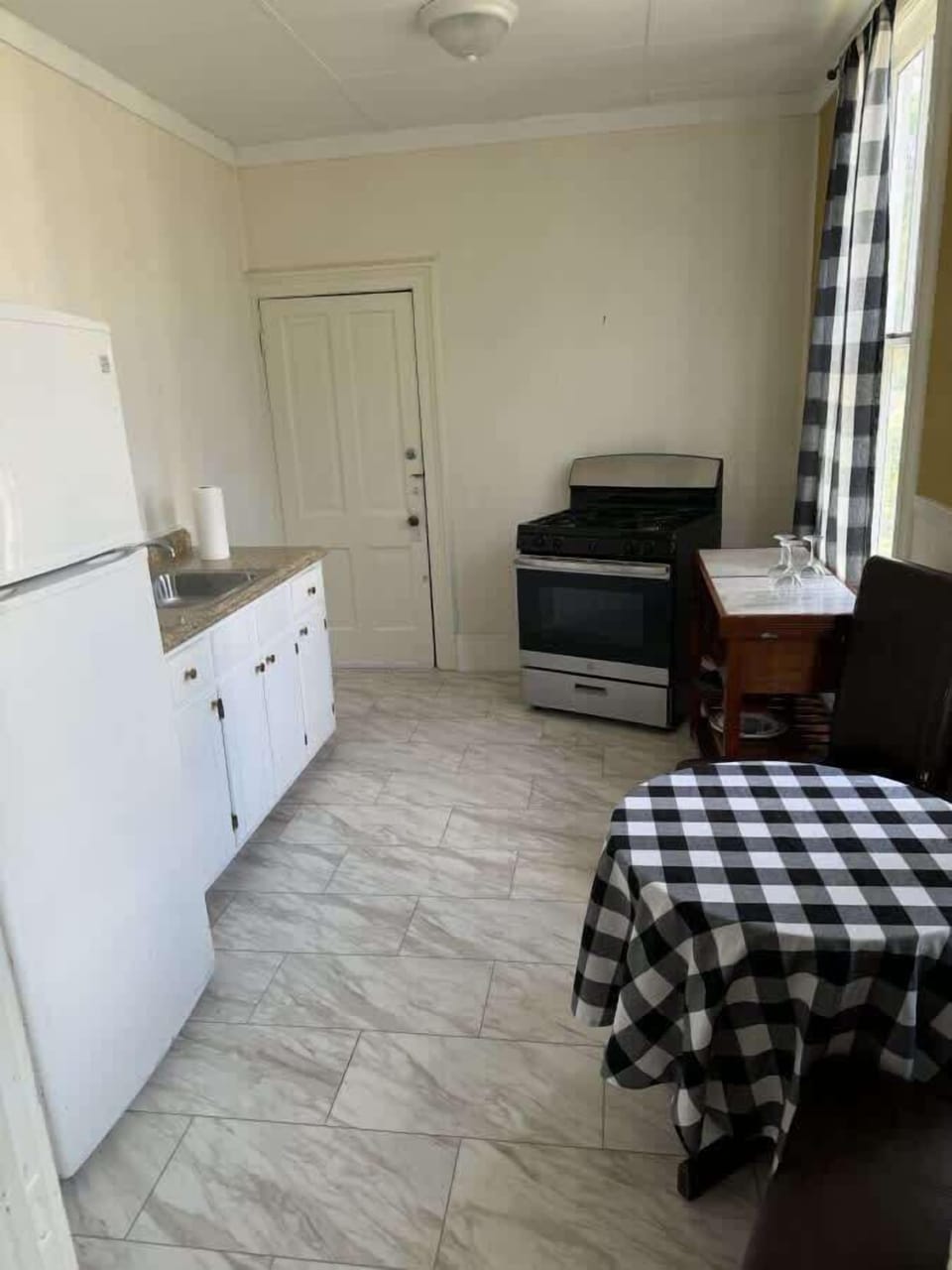 Kitchen with stove fridge and oven