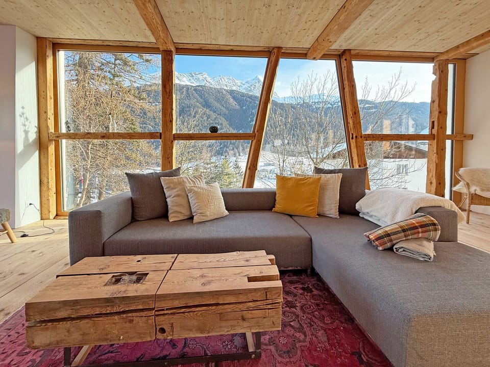 Living area with sofa and mountain view