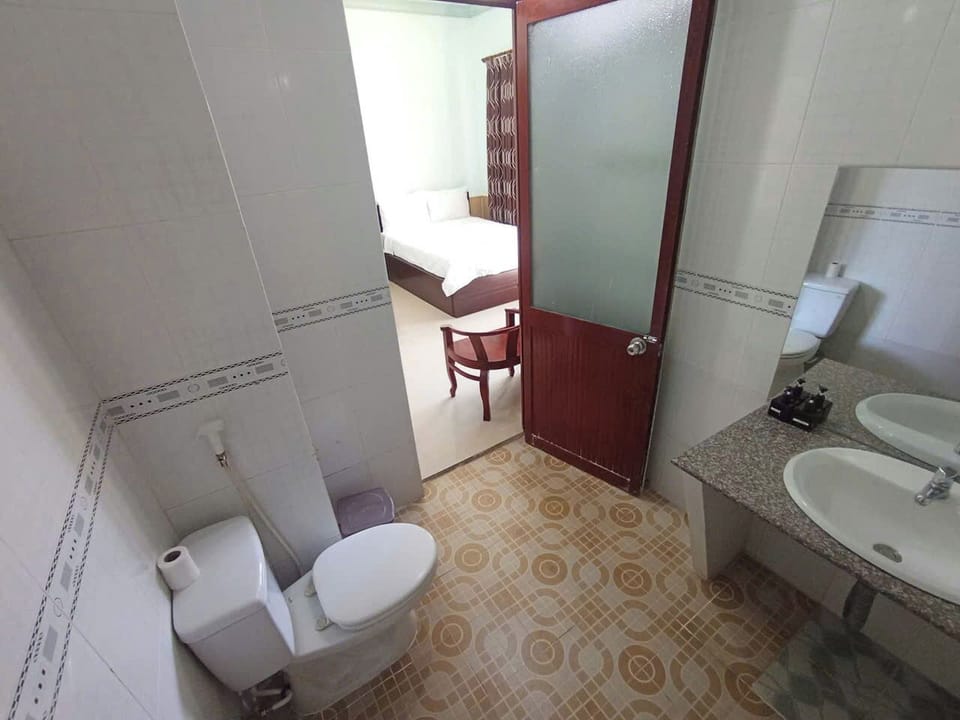 Basic Quadruple Room, Garden View | Bathroom | Shower, hair dryer, towels, soap