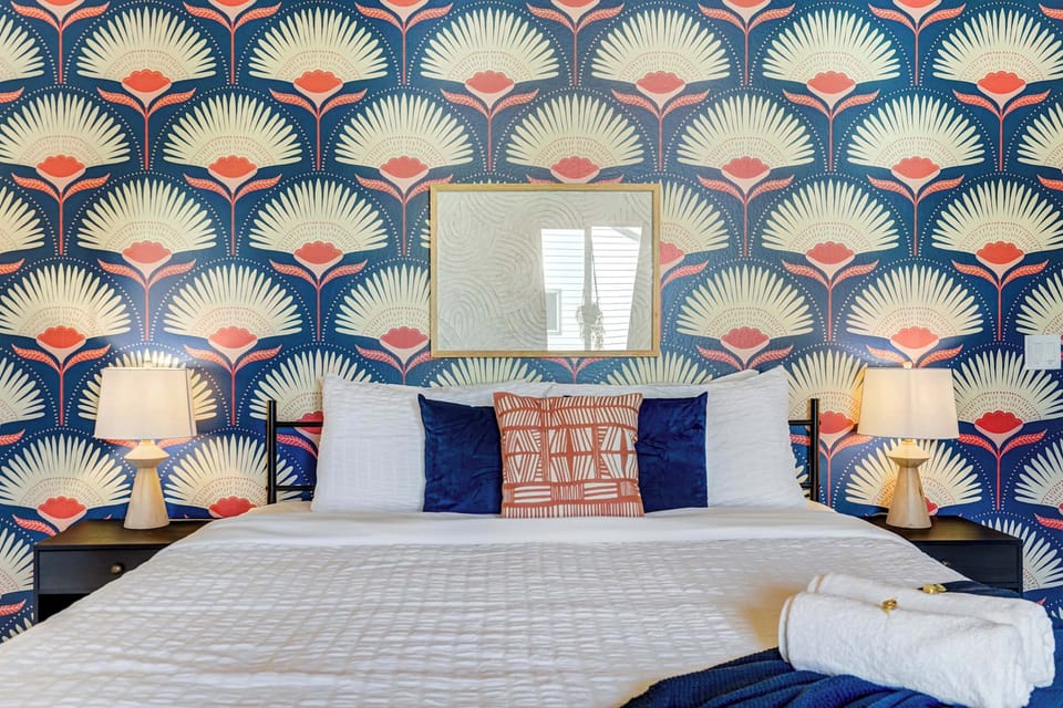 Retreat to this stylish and comfortable bedroom, featuring a cozy queen bed and unique decor for a restful night's sleep.