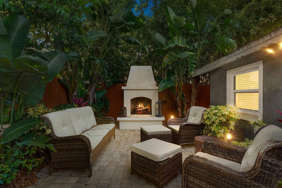 Cozy up by the fire and enjoy the enchanting ambiance of this private patio.