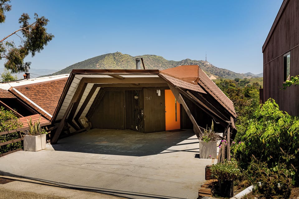 The front of the house where you'll pull in to the carport. Room to fit 2 cars. Level 2 40A EV charger available for your use.
