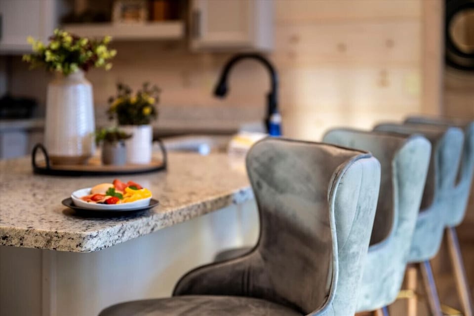 There are 4 bar stools at the kitchen counter bar for additional seating if needed.