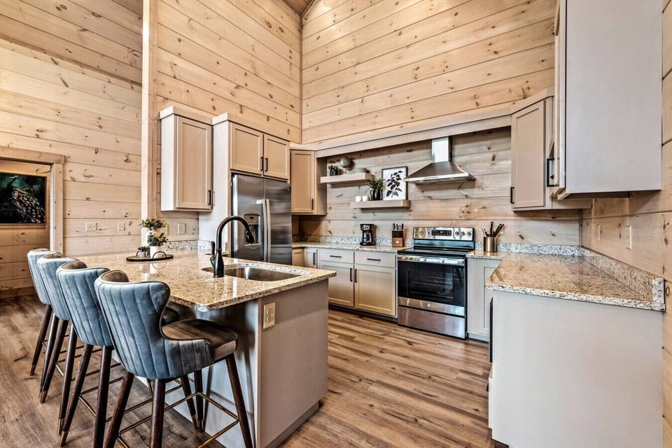 The kitchen is fully equipped with new stainless steel appliances and everything you need to make delicious meals from the comfort of the cabin.