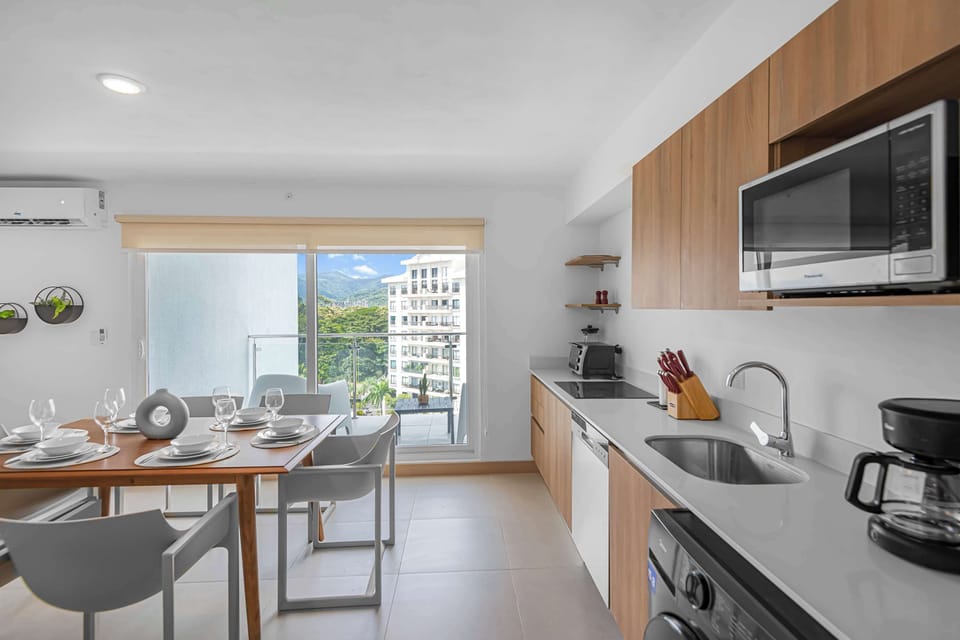Open Concept Kitchen: Modern and fully equipped, this open-concept kitchen is designed for both function and style. With plenty of counter space, sleek appliances, and a bright, airy layout.