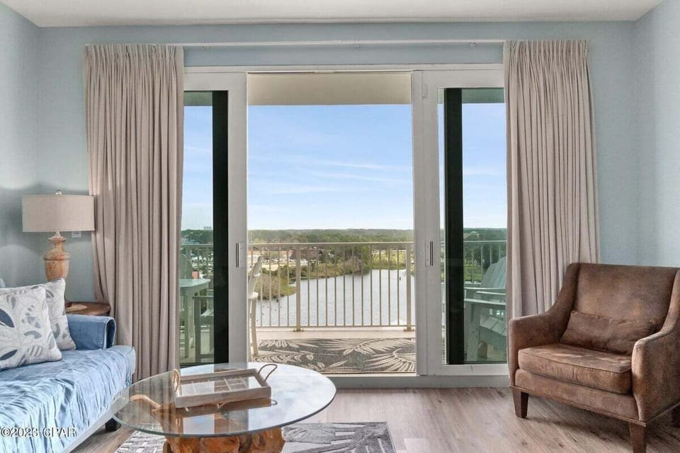 Living room with comfortable seating and lake views